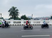 Arus lalu lintas yang lancar di atas bentang Jembatan Otista Bogor dengan trotoar yang rapi di sisi kiri dan kanan.
