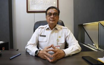 Tangkapan layar antarmuka sistem OSS (Online Single Submission) dengan spanduk pengumuman jadwal pelaporan LKPM Triwulan I 2026