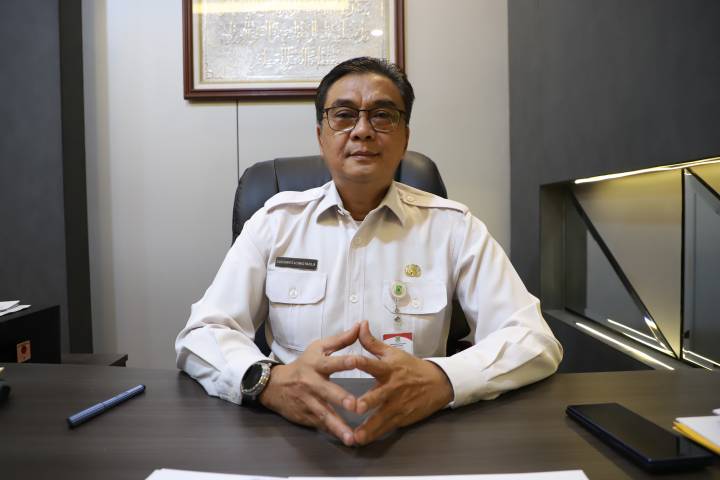 Tangkapan layar antarmuka sistem OSS (Online Single Submission) dengan spanduk pengumuman jadwal pelaporan LKPM Triwulan I 2026