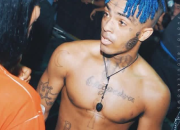 Sampul album hitam putih ikonik XXXTentacion dengan ekspresi melankolis yang khas.