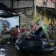 Evakuasi warga menggunakan perahu karet di Perumahan Bukit Pamulang Indah (BPI) Tangerang Selatan saat banjir malam hari.