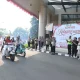 Iring-iringan ratusan pengendara motor dari berbagai komunitas mengibarkan bendera Merah Putih di jalanan Kota Tangerang.